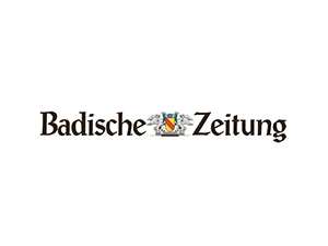Logo der Badischen Zeitung aus Freiburg mit Wappen in der Mitte, klassische Typografie, regionale Tageszeitung aus Baden-Württemberg.